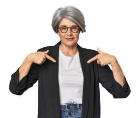 Caucasian mid-age female in business suit surprised pointing with finger, smiling broadly.