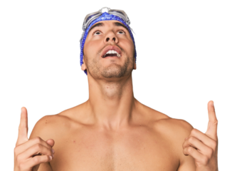 Close-up of Hispanic male swimmer with goggles, winner's attitude