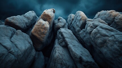 Obraz premium A dramatic close-up of rugged rock formations against a dark, moody sky, highlighting the texture and natural structure of the stones.