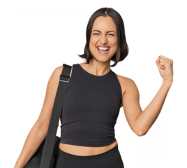 Young Caucasian sportswoman with backpack raising fist after a victory, winner concept.