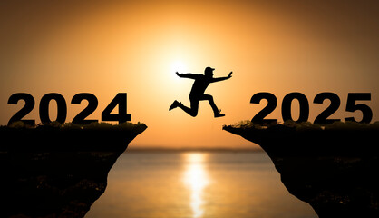 2025 year concept. Silhouettes of active people in nature against the backdrop of sunset and the numbers 2025