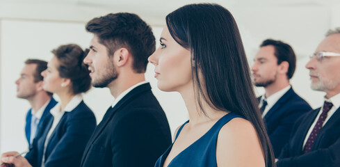 Close up of group of young people on business seminar