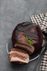 Chocolate mini cake with chocolate ganash on gray background