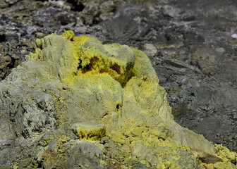 Close-up of a yellow sulfuric rock in the Tamagawa Onsen