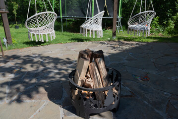 fireplace, hearth in the summer garden, coziness in the house in the evening