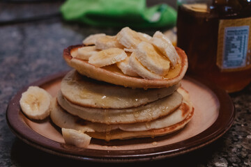stack of pancakes with bananas