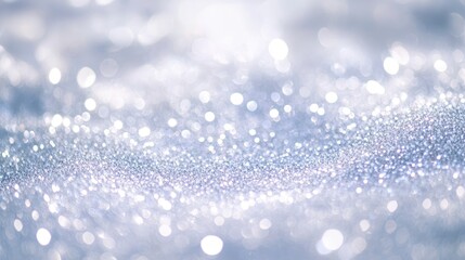 Blurry white glitter background with soft sparkles and glowing highlights, leaving space for text. Ideal for winter, wedding, or luxury themes.