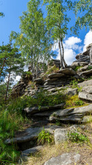 Devil's Hillfort complex on sunny summer day. Iset Park, Iset village, Sverdlovsk region, Russia. Hiking and walking.  Vertical image