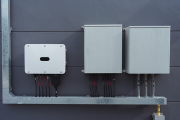 Instalation control of inverters solar panel on the wall. Technology of solar renewable energy