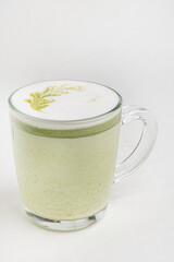 matcha latte in white cup on the white