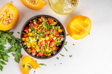 Autumn pumpkin and vegetable salsa. Mexican pumpkin, fresh vegetable and corn salad. Healthy vegetarian food, copy space