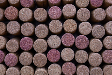 Wine corks on white background, stylish card with copy space for text and deep shadows of corks