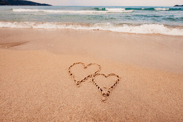 The inscription I love you on the seashore with palm trees