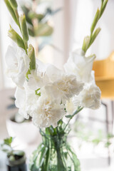 Beautiful bouquet of white carnations and gladiol