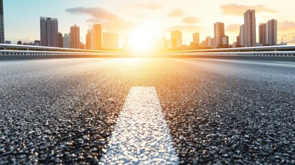 Obraz premium A scenic view of a modern road leading towards a sunset over a city skyline, symbolizing travel and adventure.