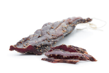 Delicacy dry smoked beef meat isolated on white