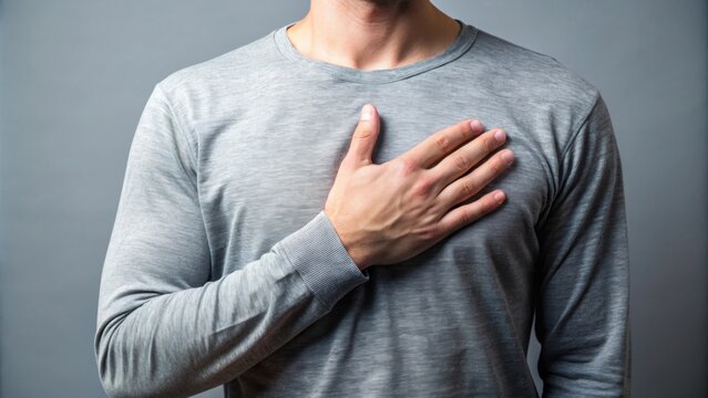 A person standing with a hand on their heart, symbolizing honesty and trustworthiness, honesty, trust, integrity