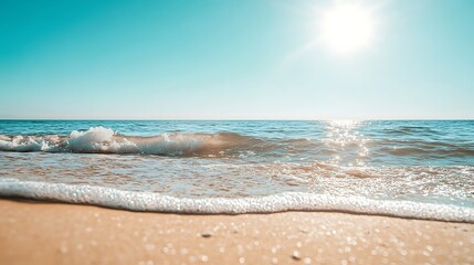 Summery Beach Scene with White Waves and Blue Sky