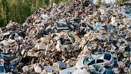 a mountain of metal waste at a metal recycling and collection point