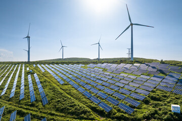 view of solar power station and wind power station on hill