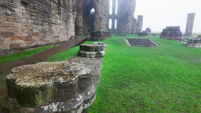 Foggy winters scene of the famous landmark Whitby Abby now derelict and formally a Benedictine abbey and is situated overlooking the sea on the East coast of England