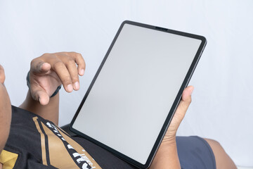 Person Using Tablet with Blank Screen, usefull for mockup tablet