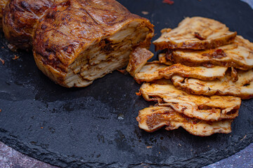 Mock meat- plant based alternative - seitan. Washed flour gluten with spices,  steamed and roasted.