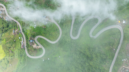 route on the back of the mountain fog and mist at Phu Tub Berk Village, Phetchabun Province, Thailand. aerial view