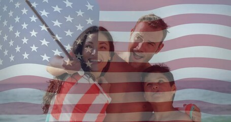 Family taking selfie on beach over waving American flag animation - Powered by Adobe