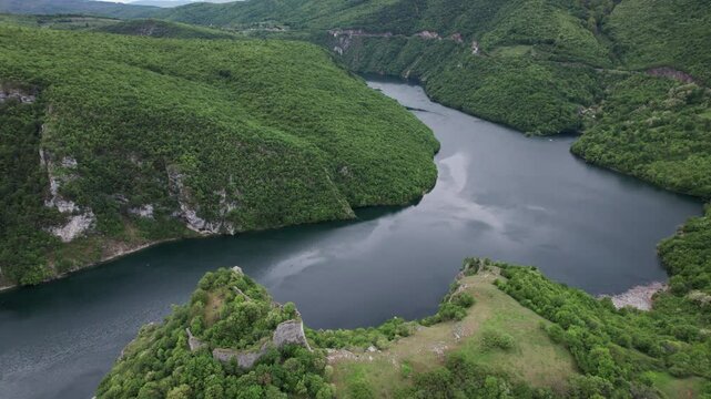 Aerial view of the beautiful river Vrbas with the fortress Bocac on top of a hill
