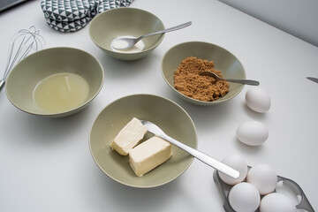 Baking ingredients: eggs, sugar, butter, milk and oil.