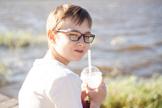 Nice boy drinking milk shake