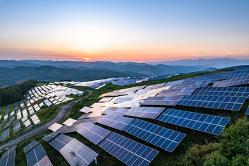 view of solar power station on mountain at sunrise