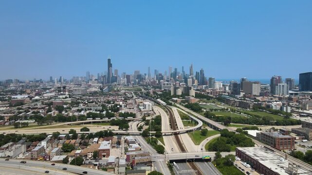 Drone footage from Armour Square in Chicago, IL, showcasing a view towards Chinatown and the I-90 highway, with the downtown skyline in the background. Crane Down Day