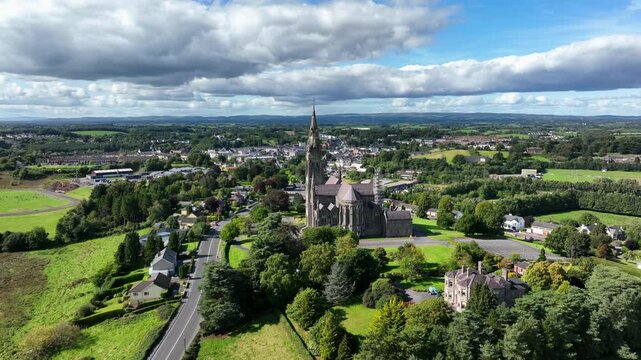 St. Macartan's Cathedral, County Monaghan, Ireland, September 2022. Drone orbits counter clockwise showcasing the Roman Catholic architecture and landscaped gardens with Monaghan town in the distance.