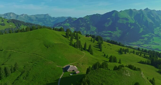 Incredible mountainous terrain of the Swiss Alps. Pristine stunning green Swiss nature in summer. Aerial view of the such an amazing view of Switzerland. Green alpine valley in Switzerland