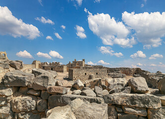 Ruins of Azraq Castle (Qasr al-Azraq) is a crusader castle (300AD),  central-eastern Jordan, 100 km east of Amman, Jordan. Against the background of a beautiful sky with clouds