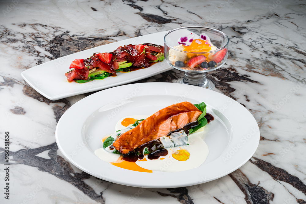 Canvas Prints dinner salmon fillet with spinach and sauces and cold appetizer carpaccio with tuna, avocado, algae,