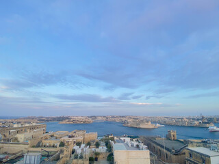 Skyline view of the beautiful coastal city of Valletta in Malta on a sunset sky