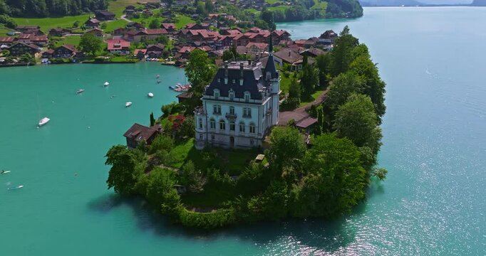 Aerial view of the Seeburg an castle on the lake. Aerial view of Iseltwald on Brienz lake in Switzerland, tranquil landscape of Swiss nature, tourism in Switzerland concept. Switzerland, Iseltwald