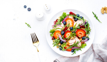 Vegan vegetable salad with olives, tomato, paprika, cucumber and onion, healthy mediterranean food. White background, top view
