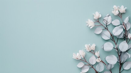 Fototapeta premium A minimalistic design featuring a silver foliage border, providing ample copy space for text or graphics. The elegant and simple layout is ideal for a modern aesthetic.