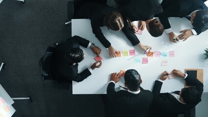 Top down ariel view of professional business team use colorful sticky notes brainstorming idea at...