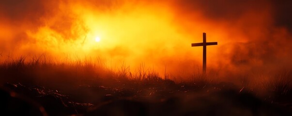 Obraz premium A serene sunset with a cross silhouetted against a vibrant, orange sky, symbolizing hope and faith in difficult times.