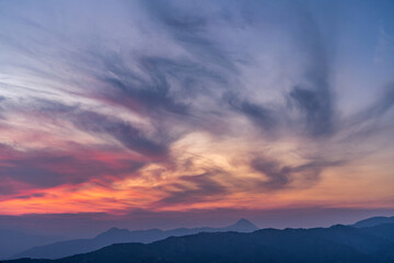 Fototapeta premium mountain sunset with intense red, blue, orange tones giving the calm and tranquility of the trip through Colombia
