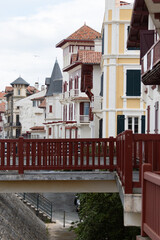 Houses and streets of old part of Saint-Jean-de-Luz fishing port on Basque coast, famous resort, known for beautiful architecture, sandy beaches, cuisine, South of France, Basque Country