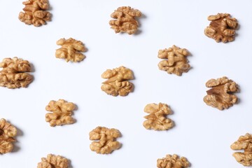 Walnuts on white background, top view