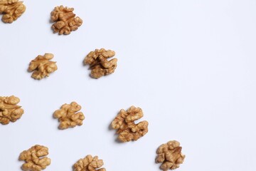 Walnuts on white background, top view