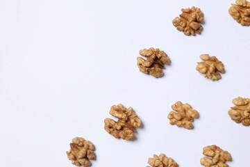 Walnuts on white background, top view