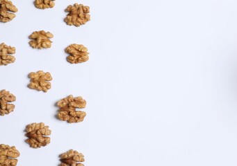 Walnuts on white background, top view